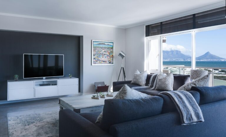 Modern living room showcasing curated furniture, neutral tones, and stylish décor, illustrating the value of professional interior decorators in 2026