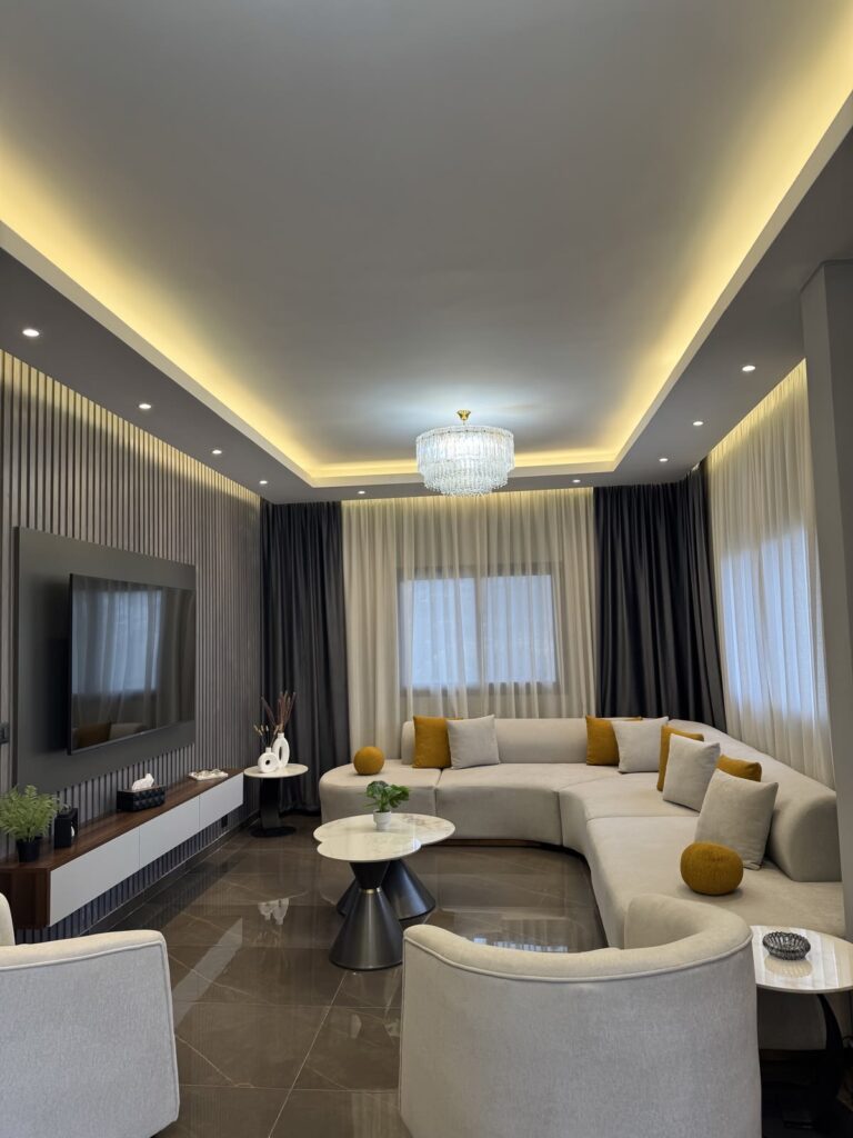 A beautiful living room in an Airbnb listing with warm color